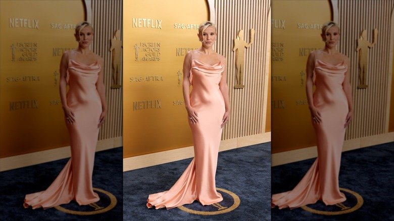 Millie Bobby Brown posing at the 2025 SAG Awards in a blush pink gown