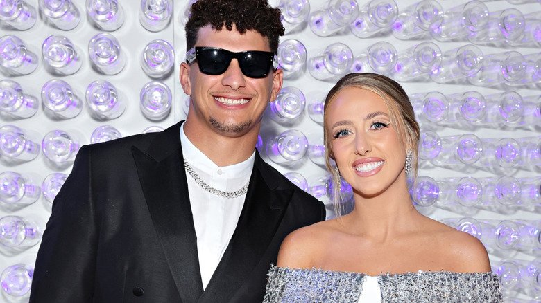 Patrick and Brittany Mahomes smiling with teeth