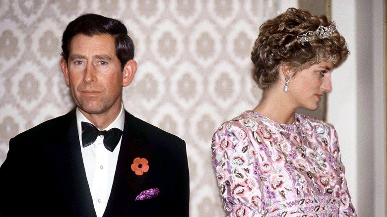 Prince Charles in a tuxedo with Princess Diana, looking off in the other direction