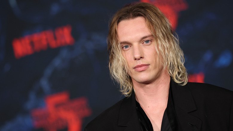 Jamie Campbell Bower posing