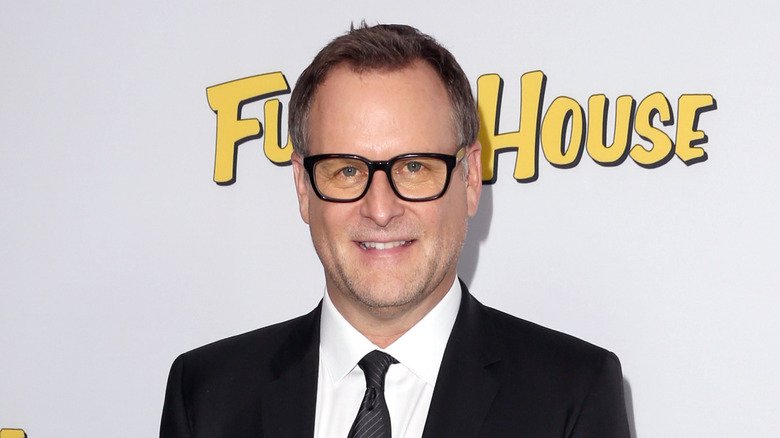Dave Coulier poses on the red carpet