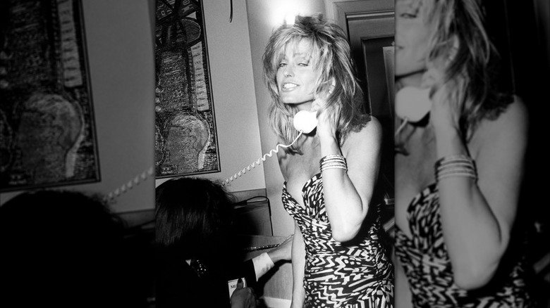 Farrah Fawcett shown holding telephone to her ear at an Oscar party