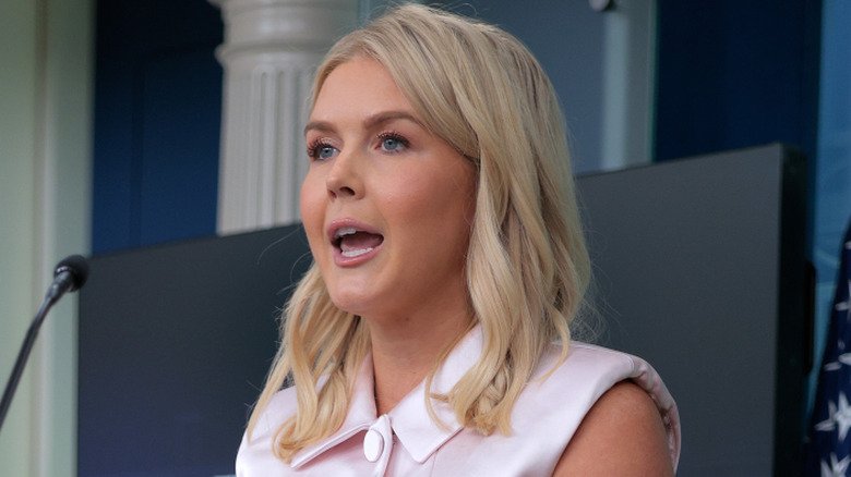 Karoline Leavitt speaking into the microphone at a White House press briefing.