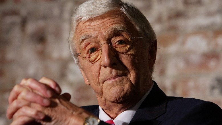 Michael Parkinson hands crossed serious