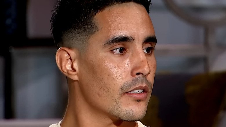 Mohamed Jbali from 90 Day Fiance looks on