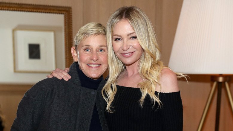 Ellen DeGeneres and Portia de Rossi smiling for a picture