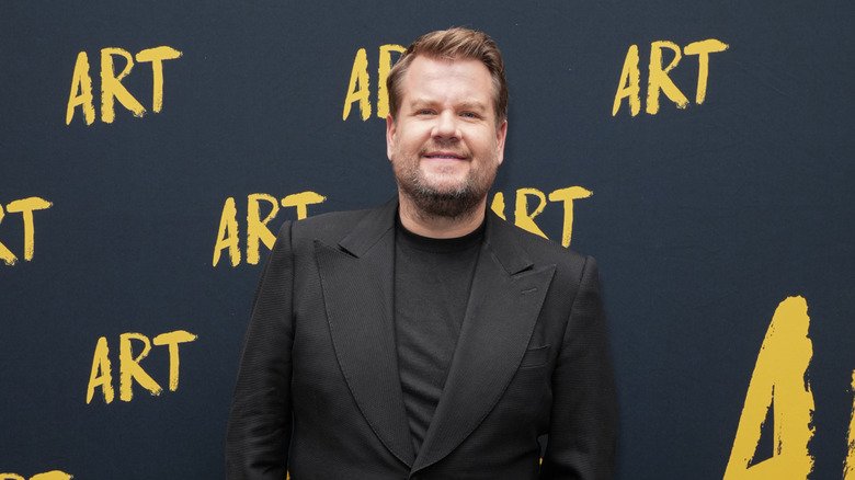James Corden — The Aftermath of Late Night: A Look at the Change 111 James Corden in a black blazer standing in front of a step and repeat for Art