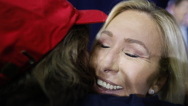 Marjorie Taylor Greene hugging a fan