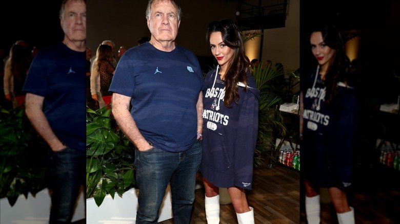 When Two Worlds Walk the Red Carpet — Bill Belichick and Jordon Hudson’s Unmistakable Contrast 131 Bill Belichick wearing a dark blue T-shirt and Jordon Hudson wearing a matching Boston Patriots sweatshirt at a party