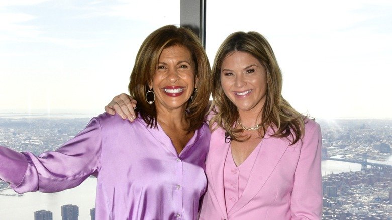 Jenna Bush Hager wraps her arm around Hoda Kotb.