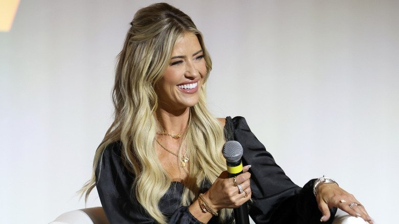 Christina Haack laughing on stage.