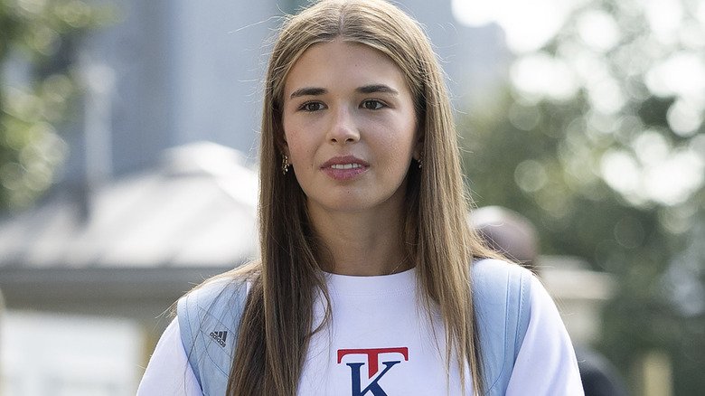 Kai Trump modeling a monogrammed sweatshirt