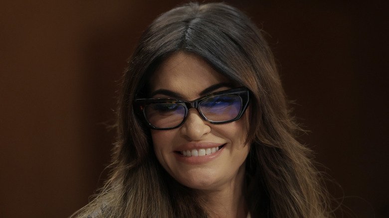 Kimberly Guilfoyle smiling in glasses