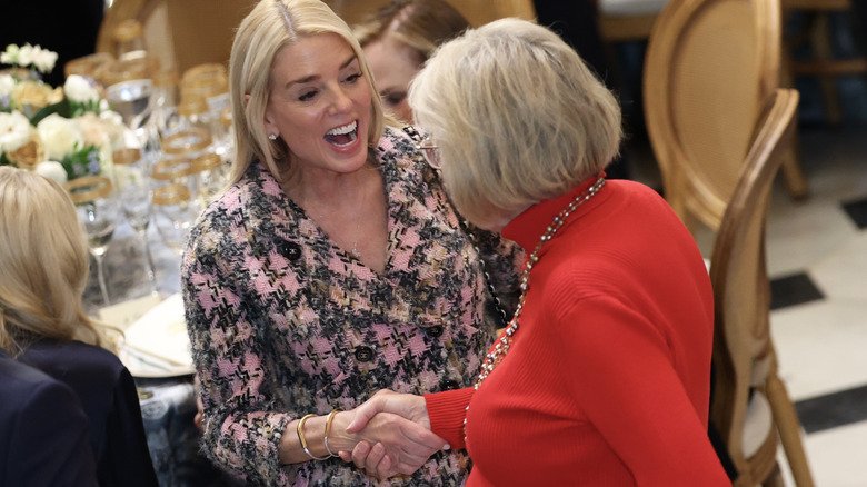 Pam Bondi shaking hands at luncheon
