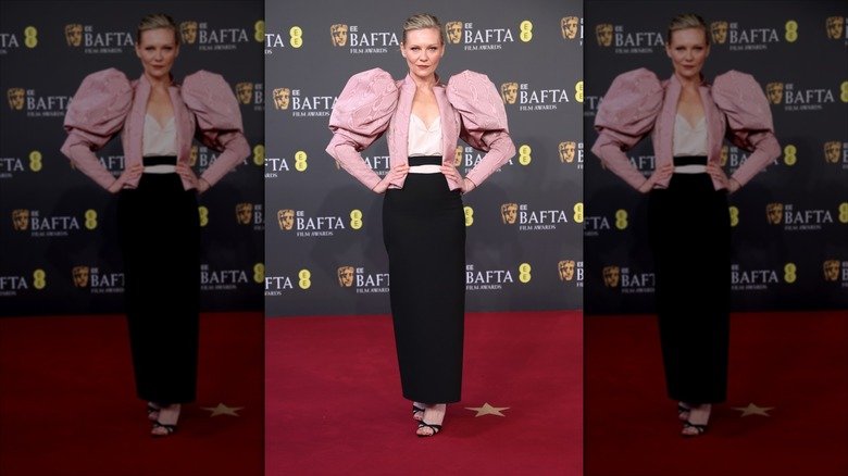 The 2026 BAFTA Awards Turned Into a Red Carpet Fashion Flop 133 Kristi Dunst posing at the 2026 BAFTAs