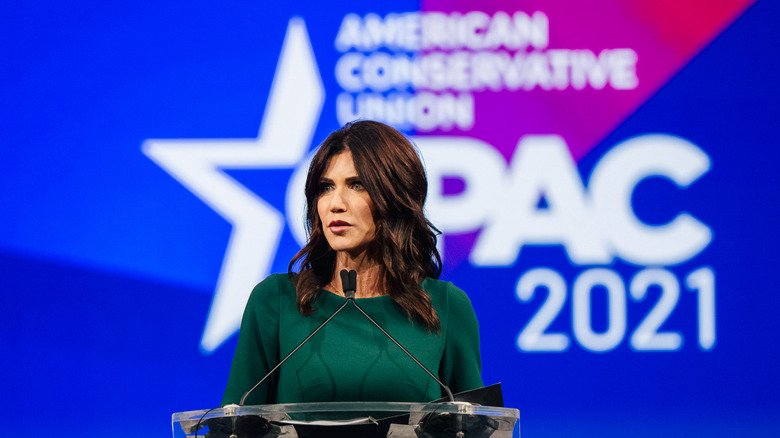Kristi Noem speaking onstage at CPAC 2021