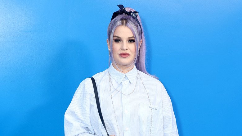 The More Candid Side of Kelly Osbourne 132 Kelly Osbourne wearing a striped collared shirt and a black bow headband