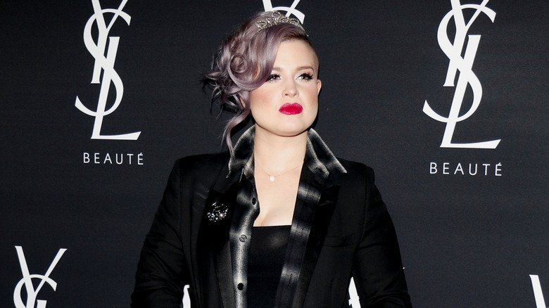 The More Candid Side of Kelly Osbourne 134 Kelly Osbourne wearing a black blazer and diamond tiara on the red carpet
