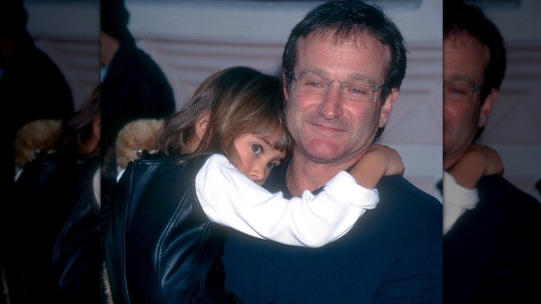 Zelda Williams' Transformation: A Stunning Sight 129 Robin Williams holding daughter Zelda Williams as a young child