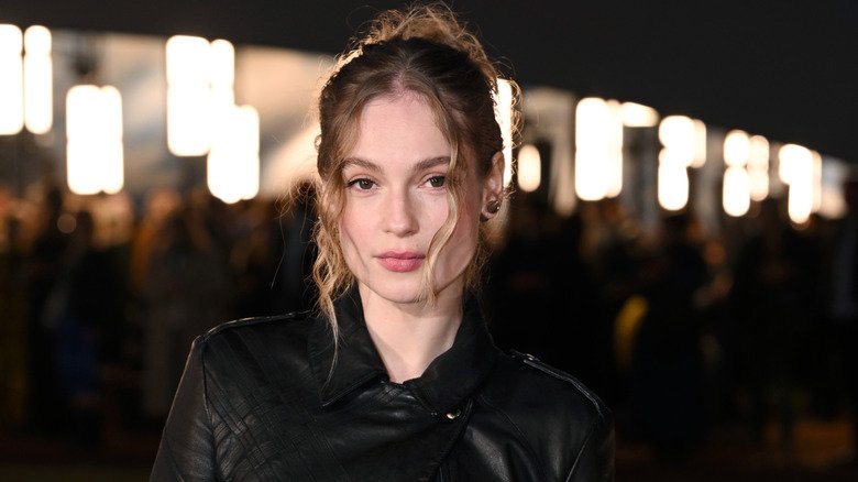 Hannah Dodd displays a pensive stare with few loose hair strands arranged around her face.