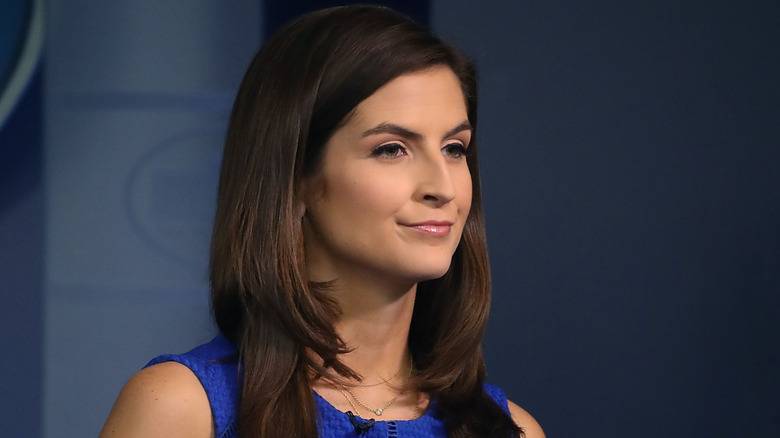 Kaitlan Collins smiling at White House press conference.