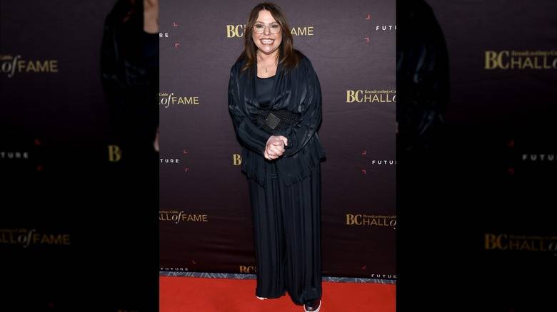 Rachael Ray Red Carpet Looks That Were Judged Too Harshly 138 Rachael Ray smiling in a black belted ensemble with glasses on.