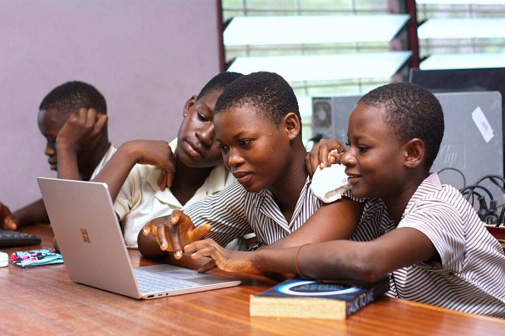 Skill Acquisition for Career Growth: 5 Proven Models That Work in 2026 141 Learners practising digital skills together on a laptop