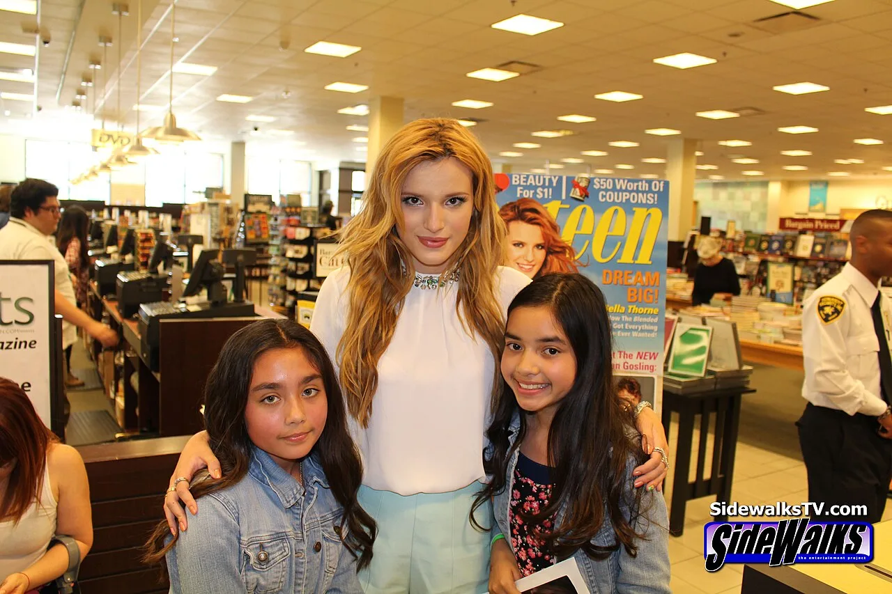 Open the featured image for Bella Thorne Image Control Story Explains the Thinking Behind Her Creator-Era Independence Bella Thorne posing with fans at a public appearance in 2014
