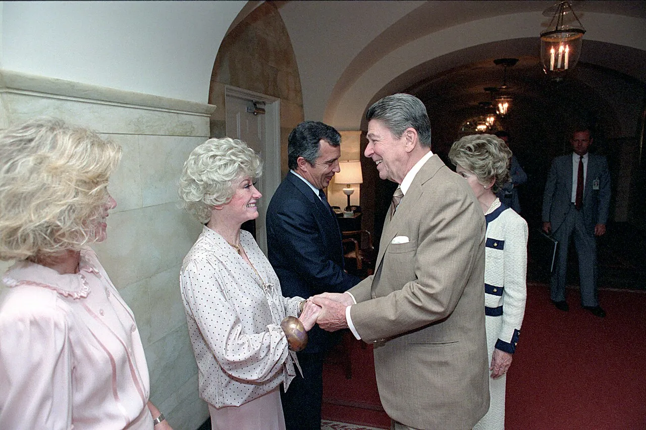 Open the featured image for Donna Mills OnlyFans Launch Challenges What Creator Fame Looks Like at 85 Donna Mills with Phyllis Diller meeting President Ronald Reagan