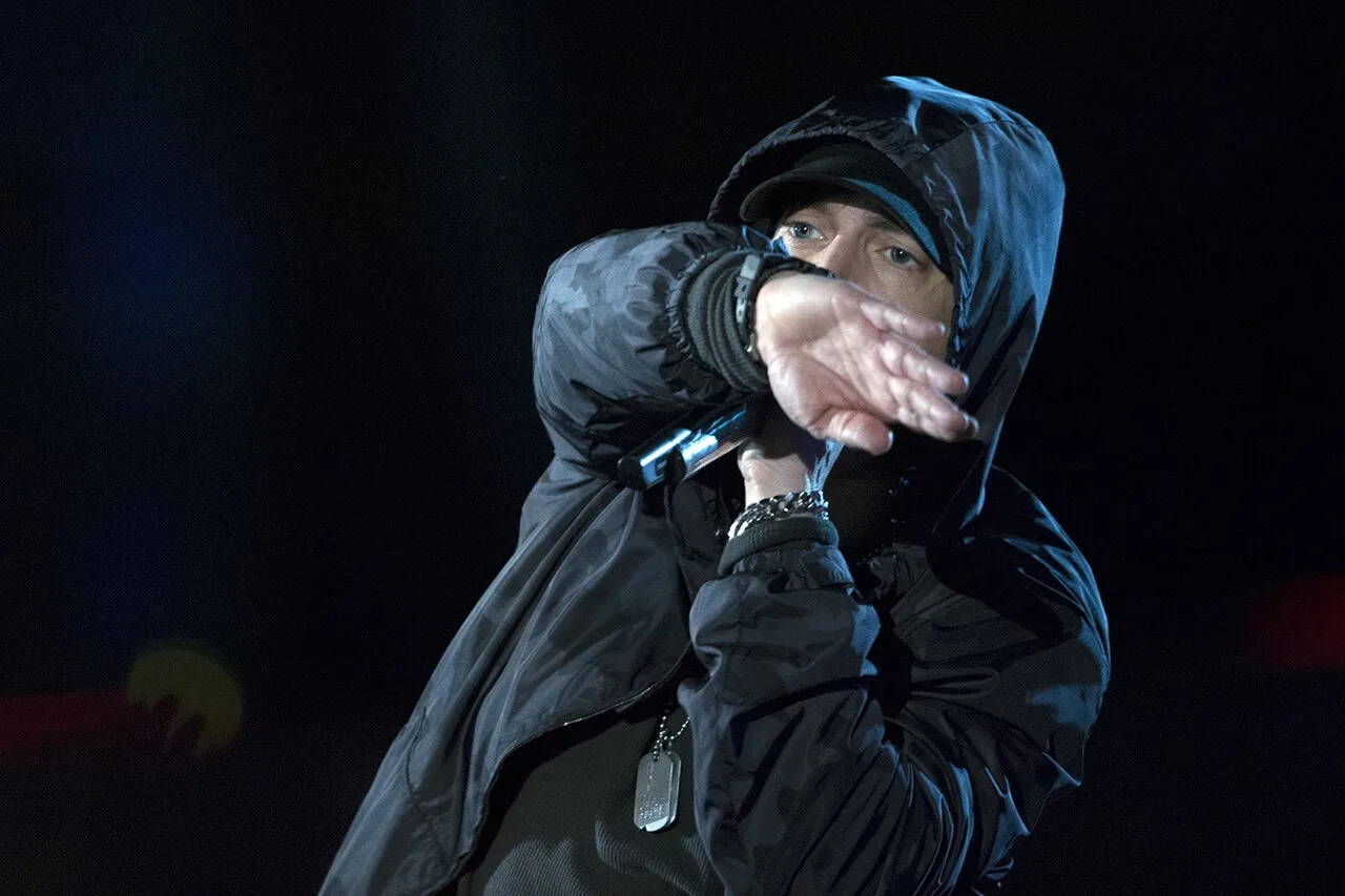 Open the featured image for Eminem Sneaker Charity Auction Puts 100+ Signed Pairs Up for a Cause Eminem performing live onstage in Washington, D.C.
