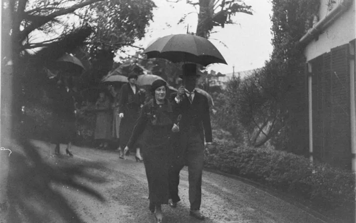 Guests arriving in formal attire for a wedding reception