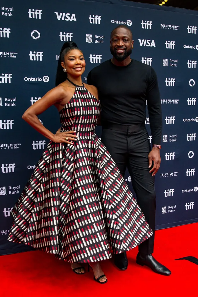 Gabrielle Union and Dwyane Wade posing together at the Toronto International Film Festival in 2024