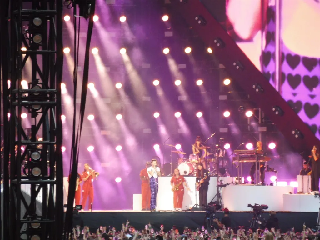 Harry Styles performing with his backing band at Wembley Stadium in 2023