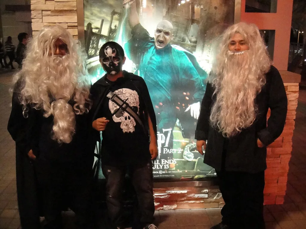 Costumed fans at a Harry Potter midnight premiere, illustrating the franchise that made Jessie Cave famous