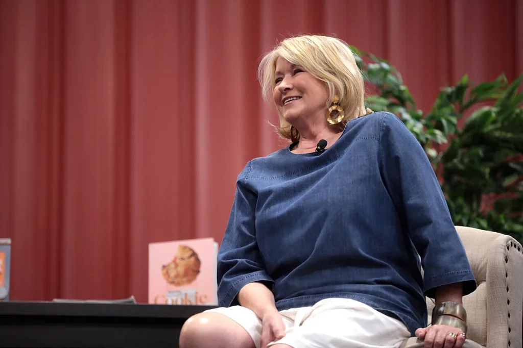 Martha Stewart speaking to an audience at a home and garden event