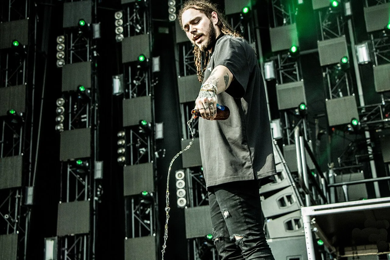 Open the featured image for Post Malone Engagement: What We Know About Christy Lee Post Malone performing on stage