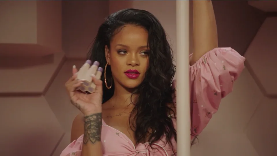 Rihanna appearing in a Fenty Beauty campaign in 2018