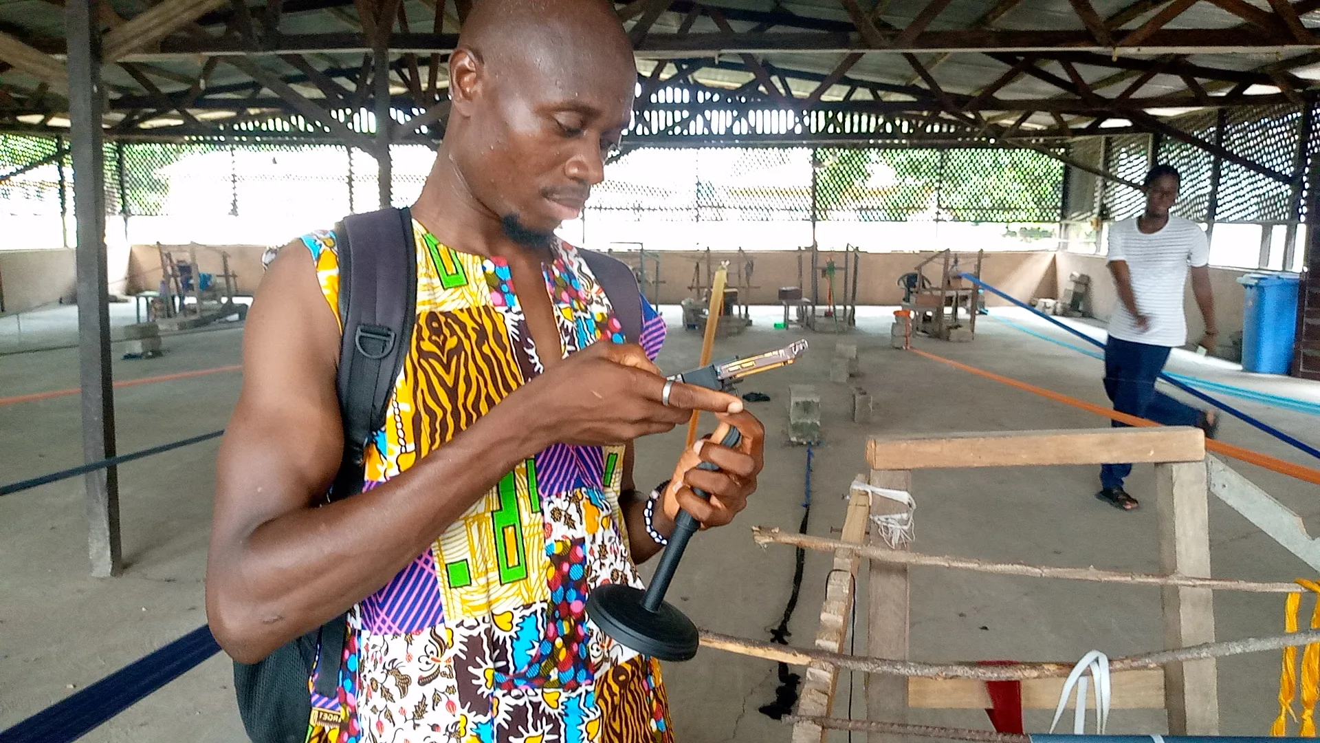 Open the featured image for YouTube Watch With Expansion Gives Creators a New Live Reaction Tool Person recording video with a smartphone, illustrating mobile creator livestreaming