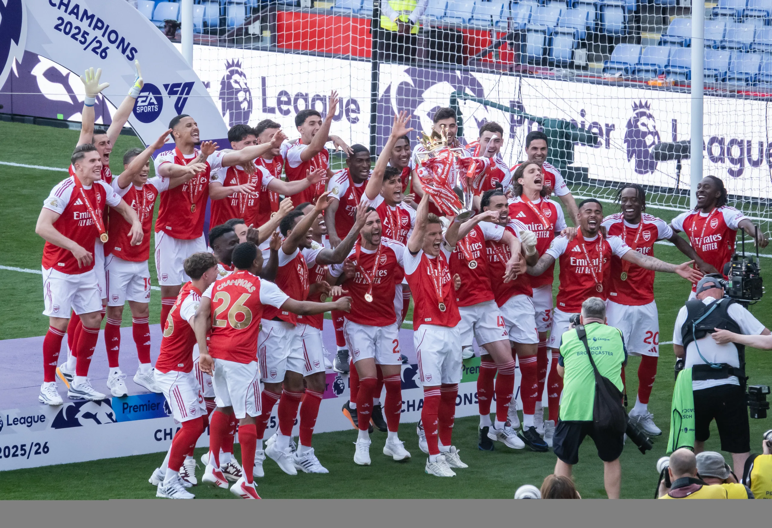 Arsenal players lift the Premier League trophy in May 2026