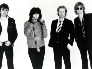 Chrissie Hynde with the Pretenders in a 1979 Sire Records publicity photo