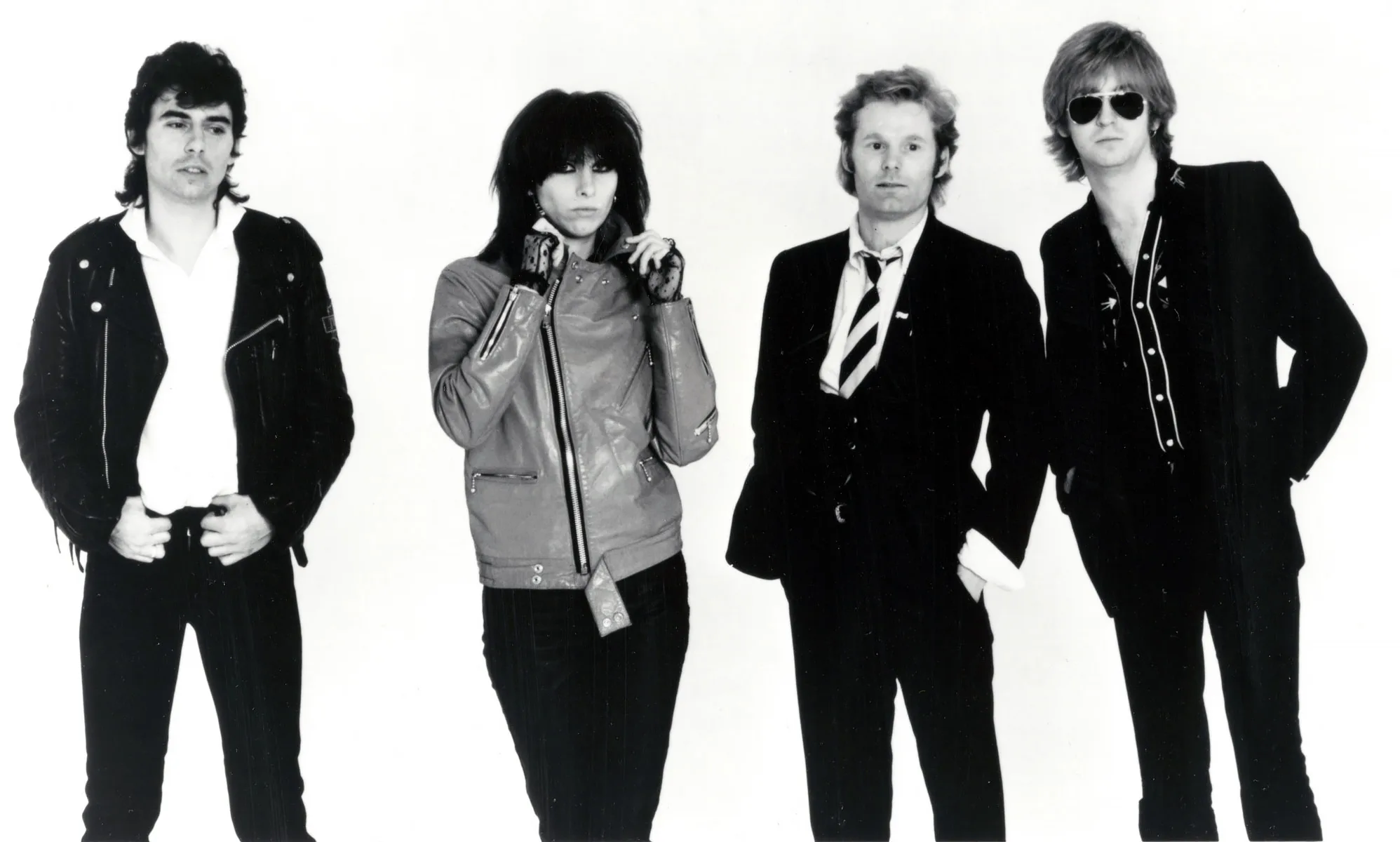 Open the featured image for Chrissie Hynde Documentary Shows Why the Pretenders Story Resists Nostalgia Chrissie Hynde with the Pretenders in a 1979 Sire Records publicity photo
