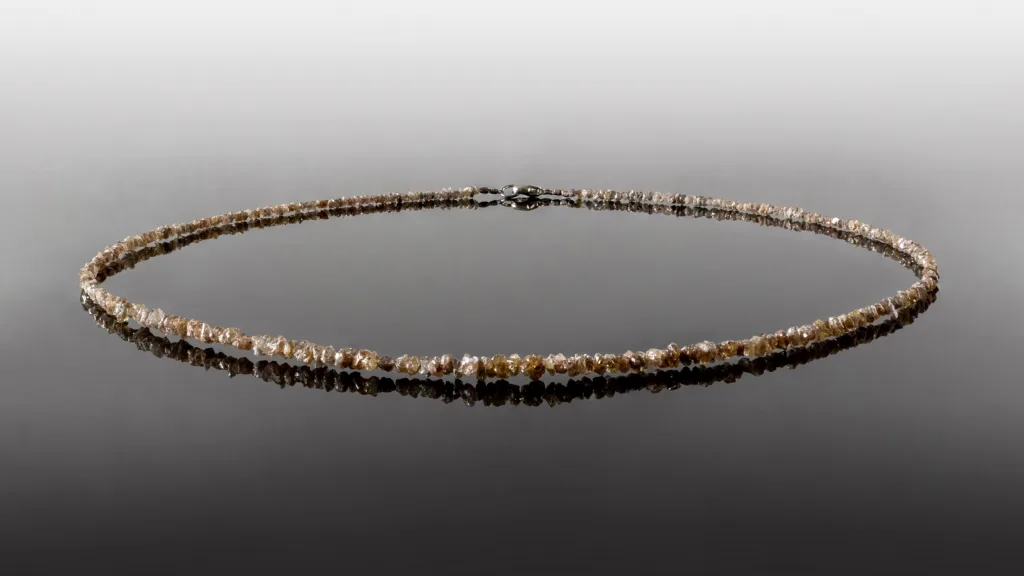 Necklace made from rough diamonds illustrating natural diamond textures