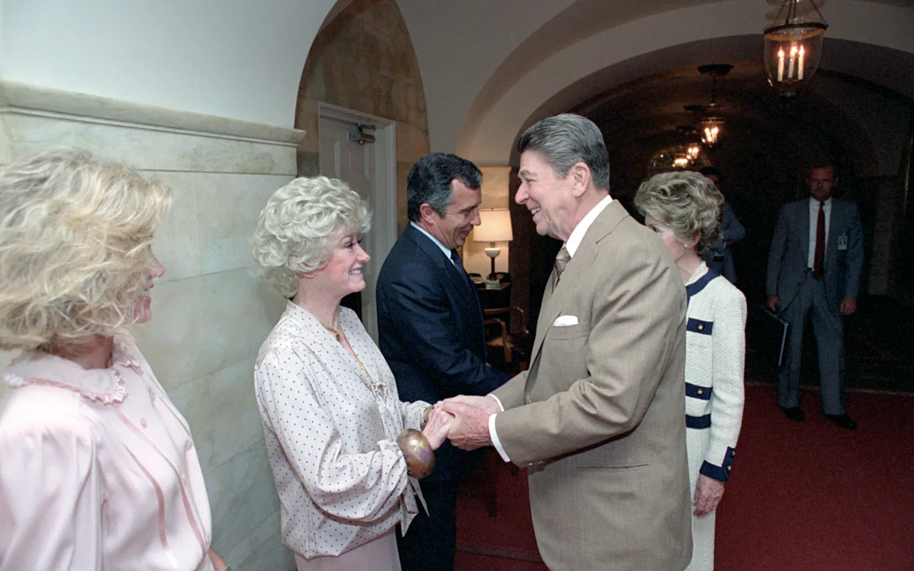 Donna Mills at a public charity event with President Ronald Reagan and Phyllis Diller