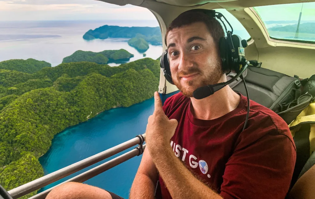 Drew Binsky flying over Palau during his travel work