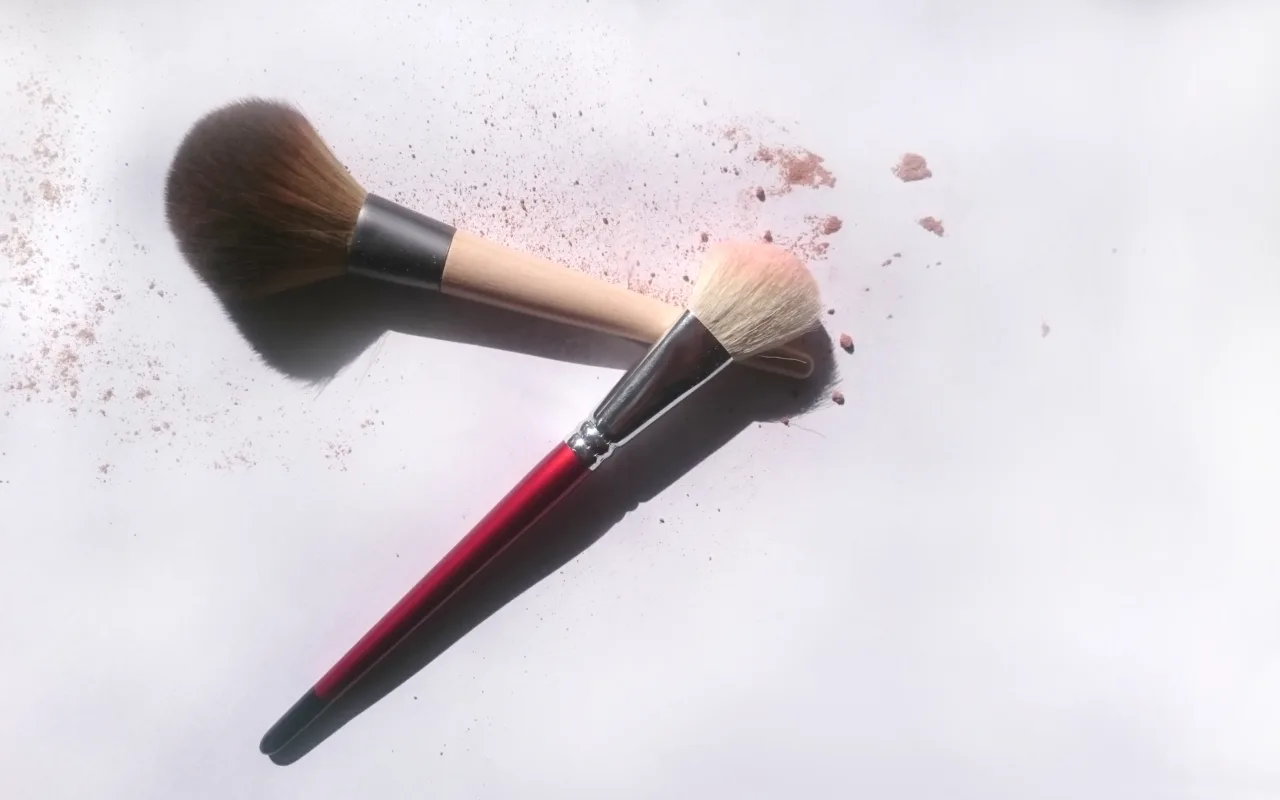 Makeup brushes with soft powder illustrating fall 2026 makeup trends