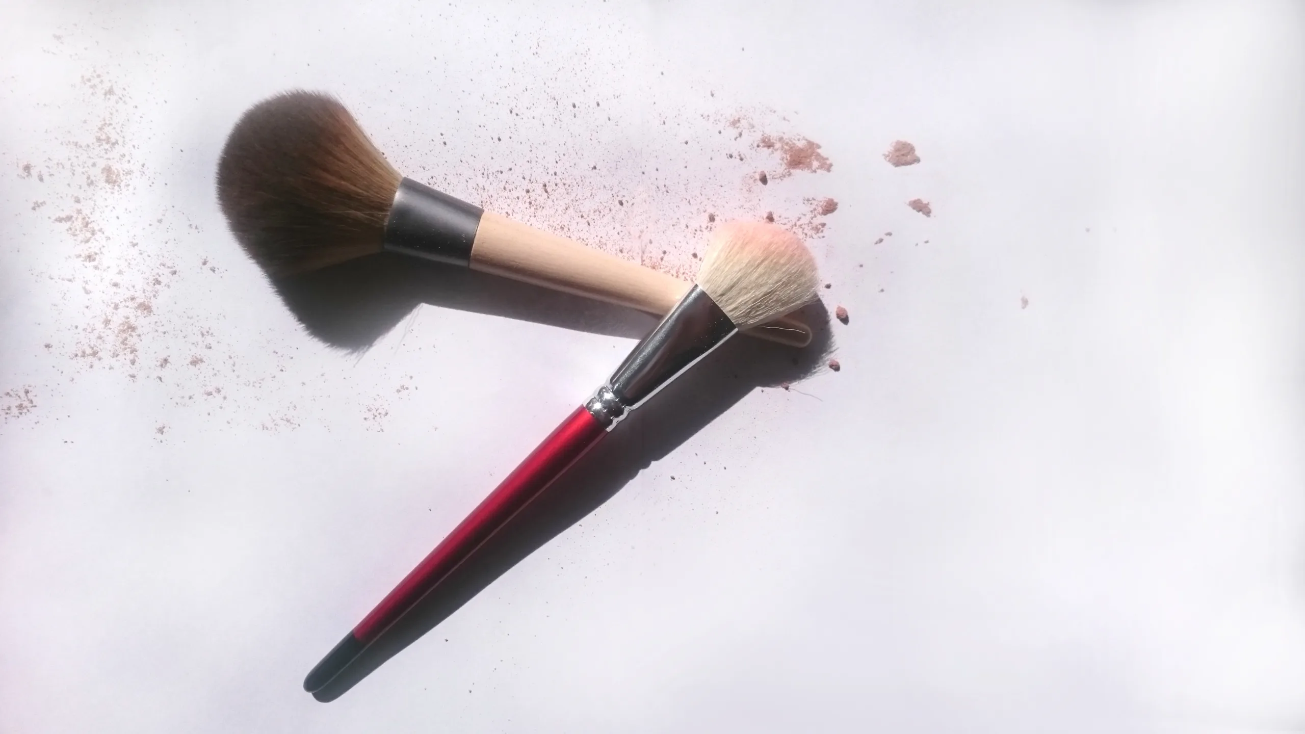 Makeup brushes with soft powder illustrating fall 2026 makeup trends