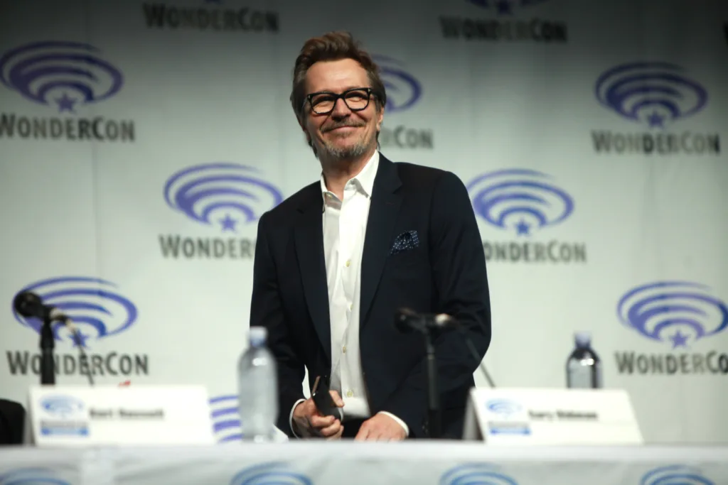 Gary Oldman speaking at a WonderCon panel for Dawn of the Planet of the Apes in 2014