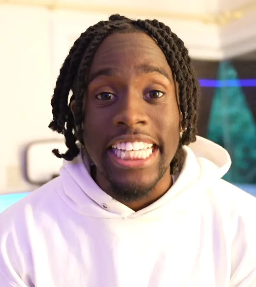 Kai Cenat in a white hoodie during a 2021 video