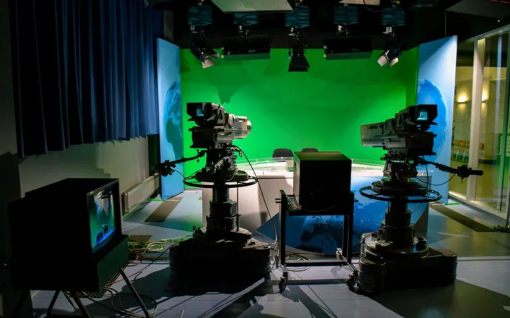 Television studio cameras and green screen representing creator FAST channels and streaming production