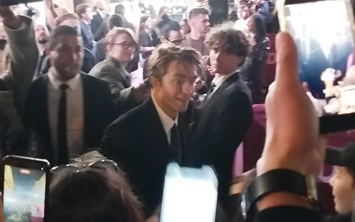 Robert Pattinson greeting fans at The Drama premiere in March 2026